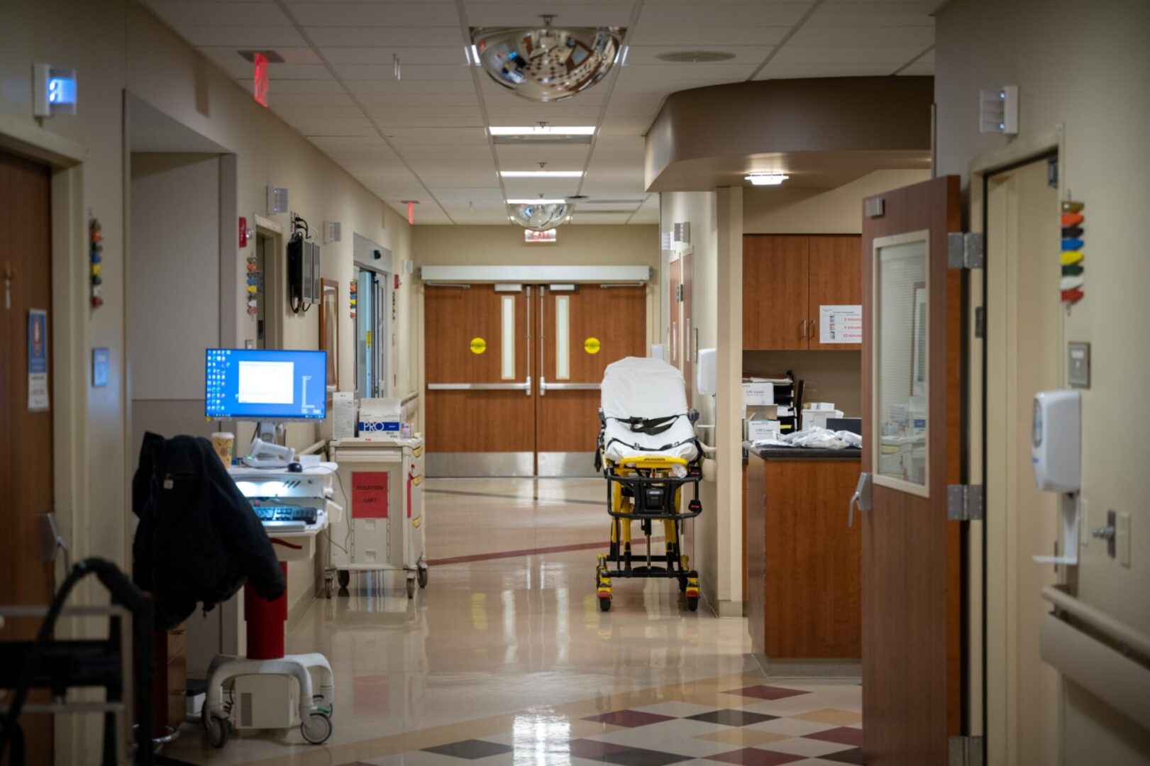 A hospital room with a patient in the back of an ambulance.