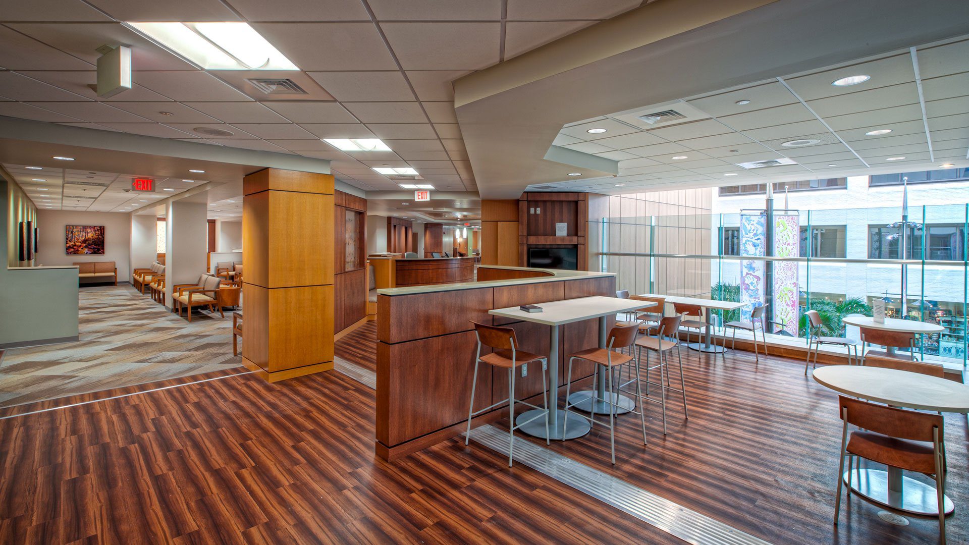 A room with wooden floors and tables in it