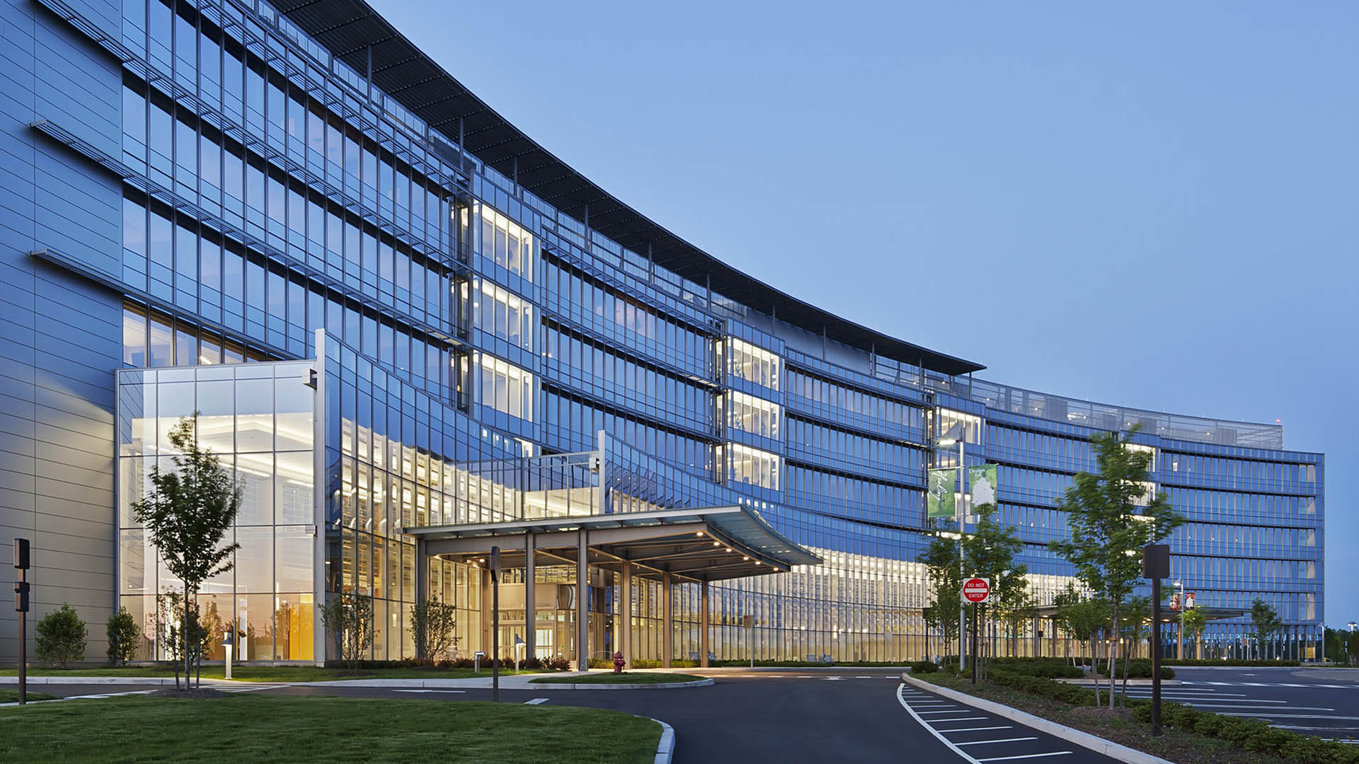 A large building with many windows and glass.