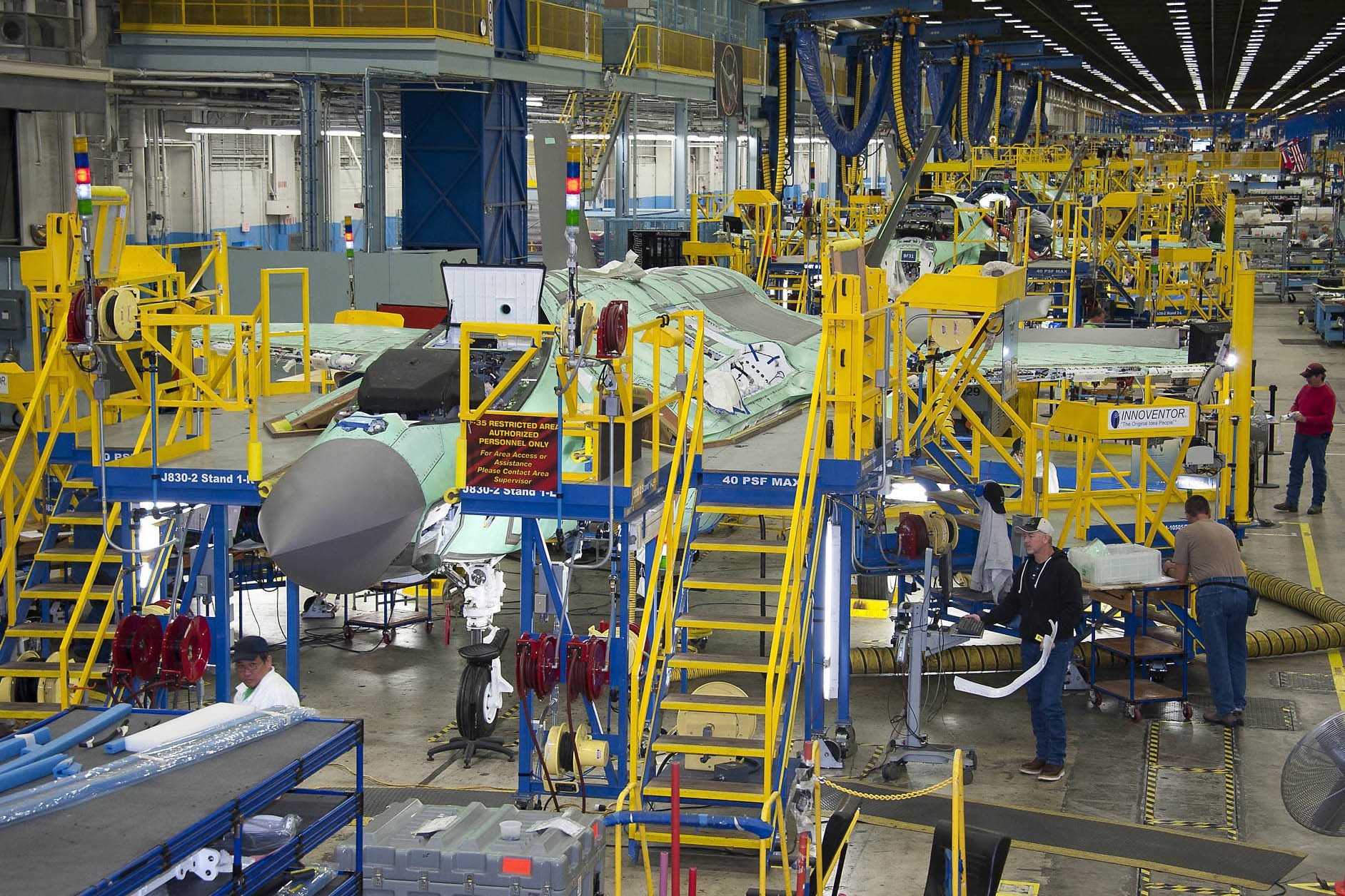 A factory with people working on the assembly line.