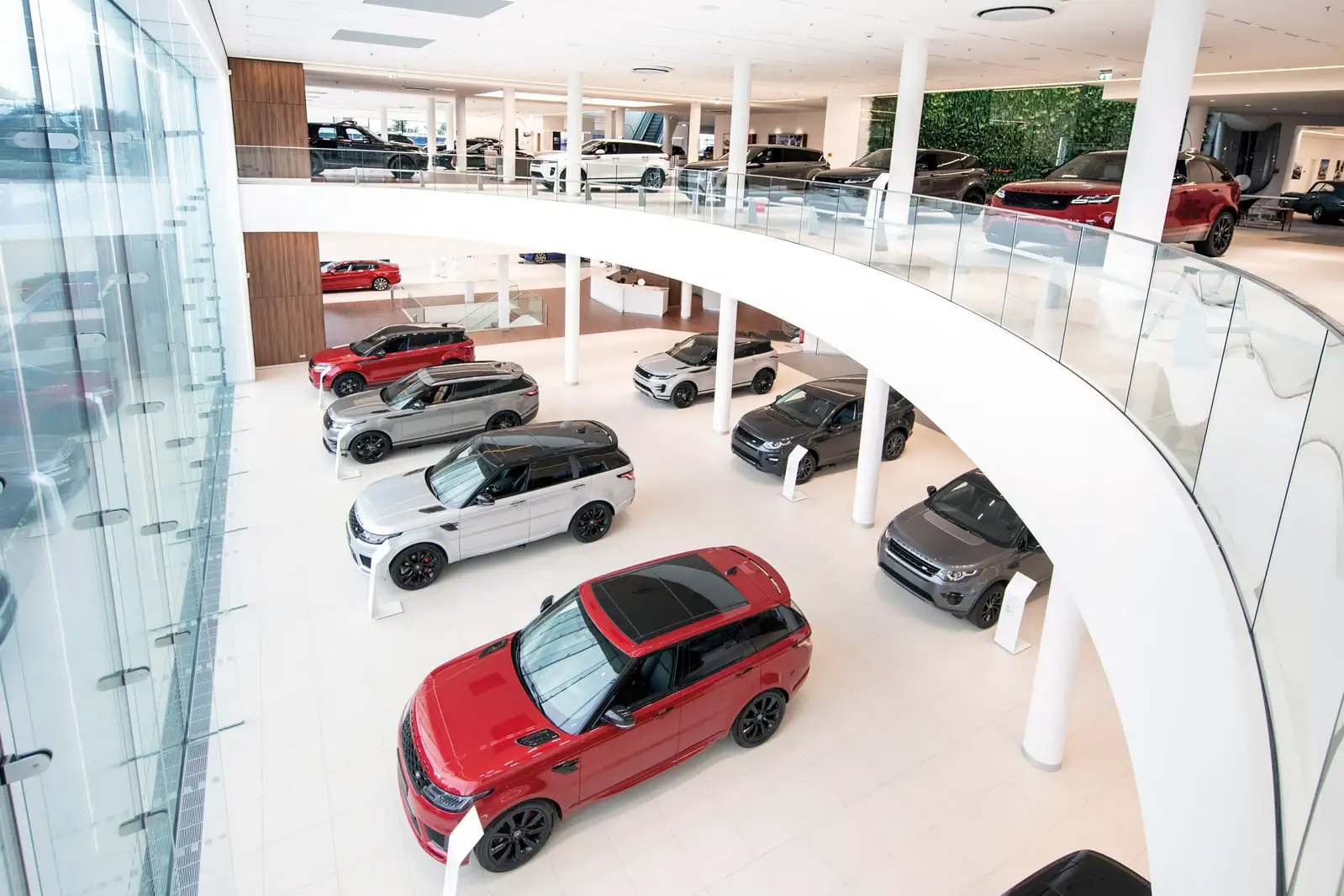 A car dealership with many cars in the center.