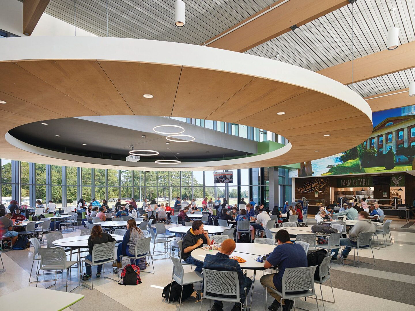 A group of people sitting at tables in a building.