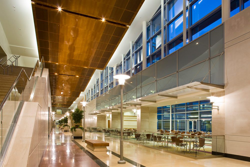 A large building with many windows and tables.