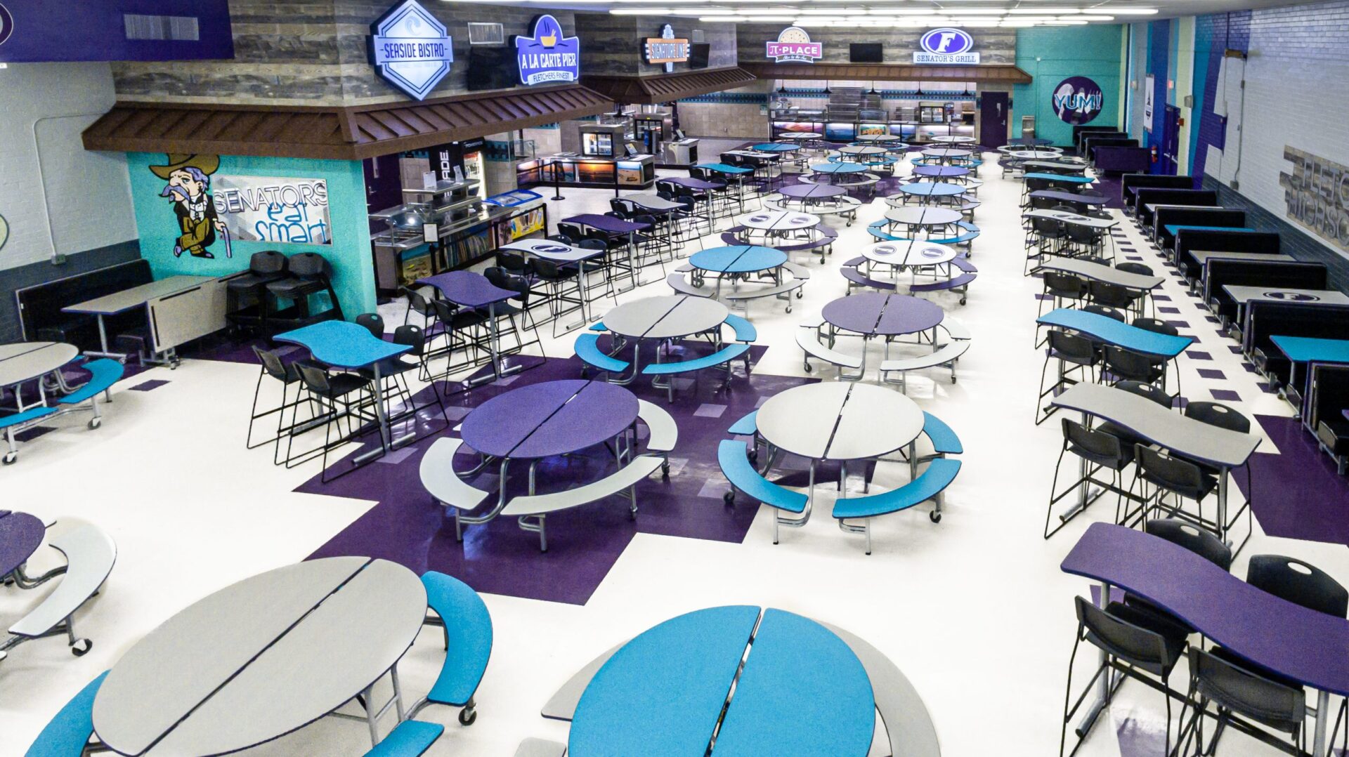 A large room with many tables and benches.