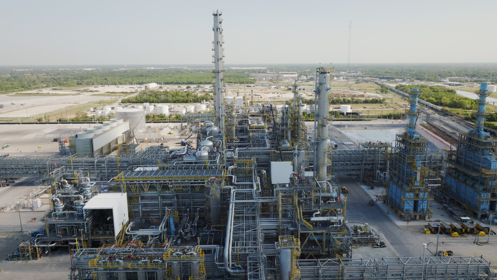 A large industrial area with many towers and buildings.