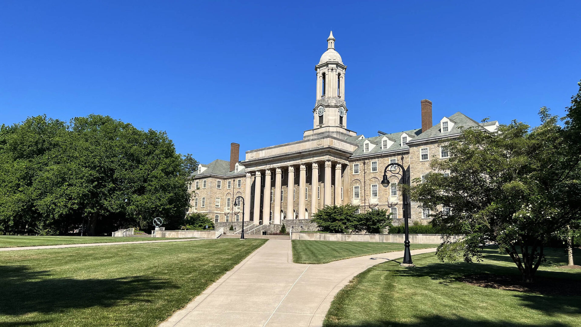 A building with a clock tower on the side of it.