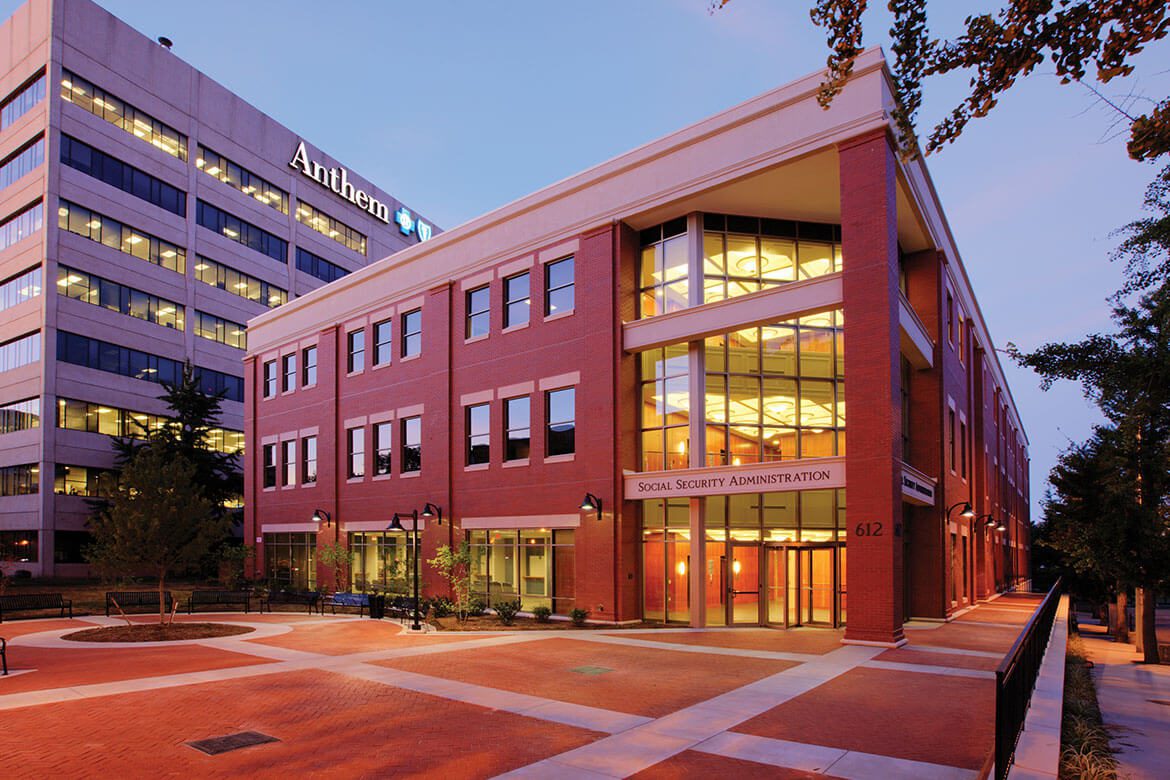 A building with many windows and glass on the outside.