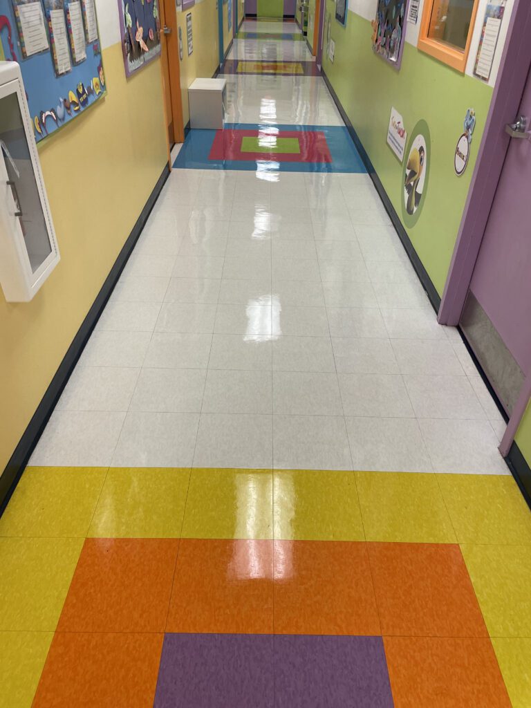 A hallway with colorful floors and walls.