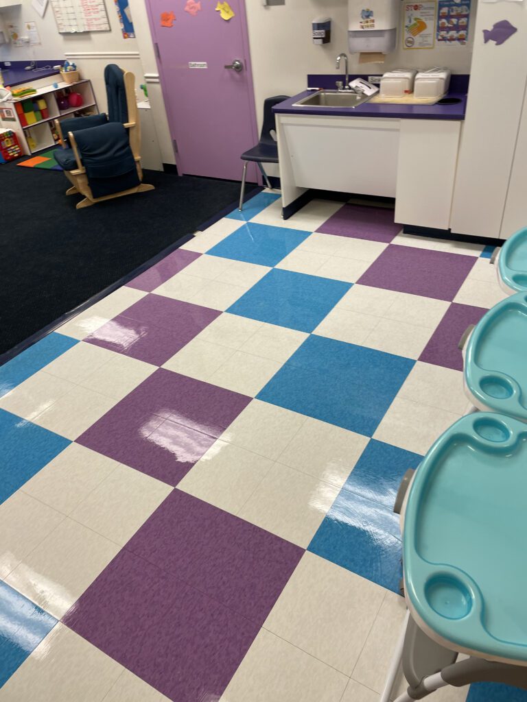 A room with a table and chairs in it