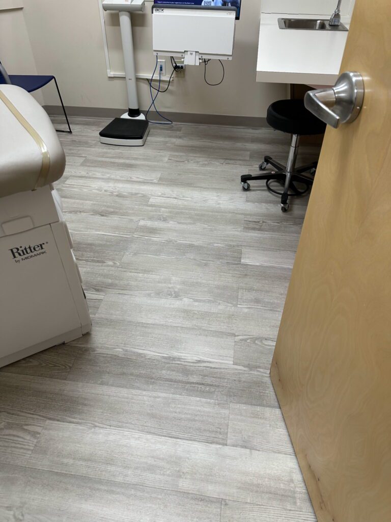 A room with a desk and chair in it